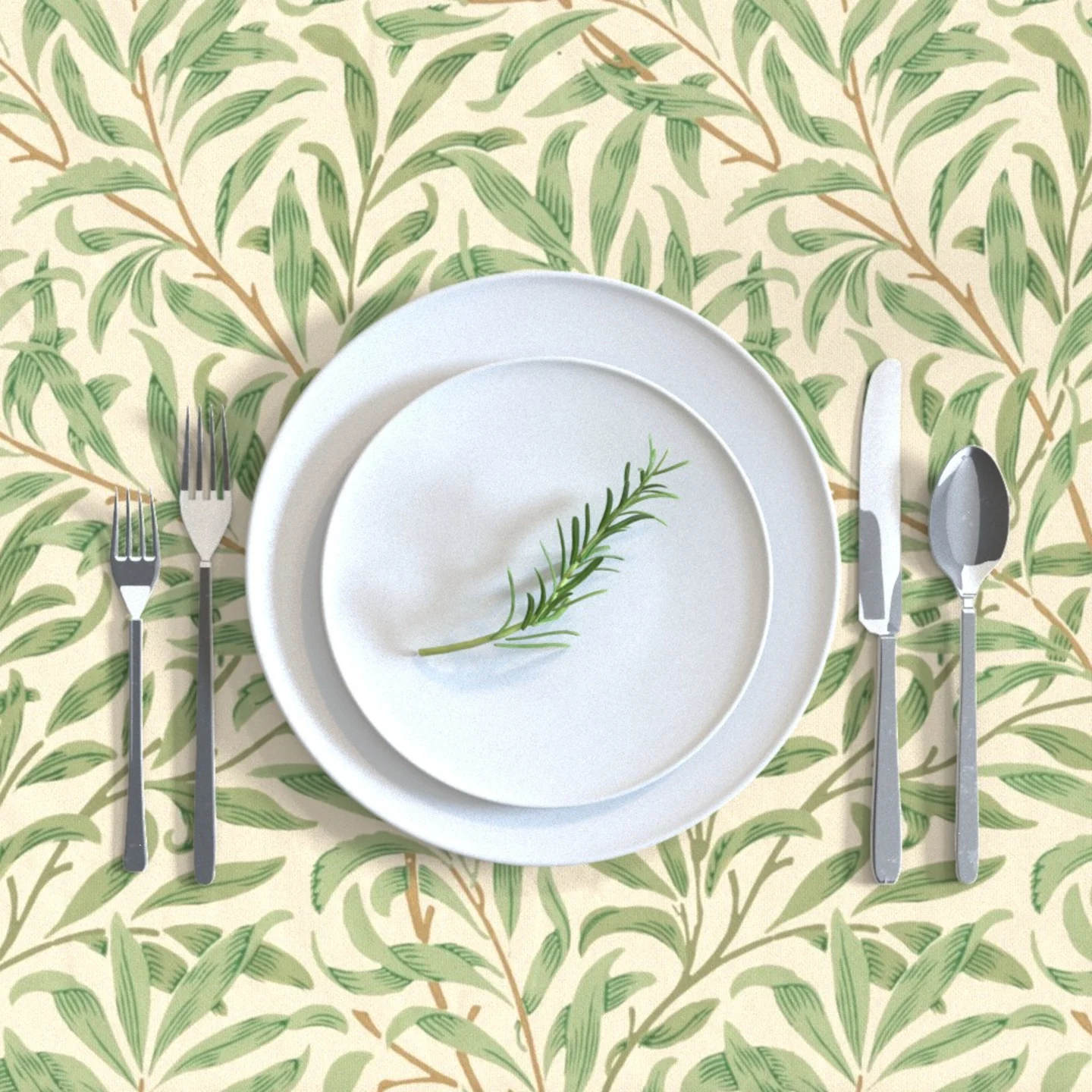 Tablecloth with a William Morris Willow Bough design and a place setting.