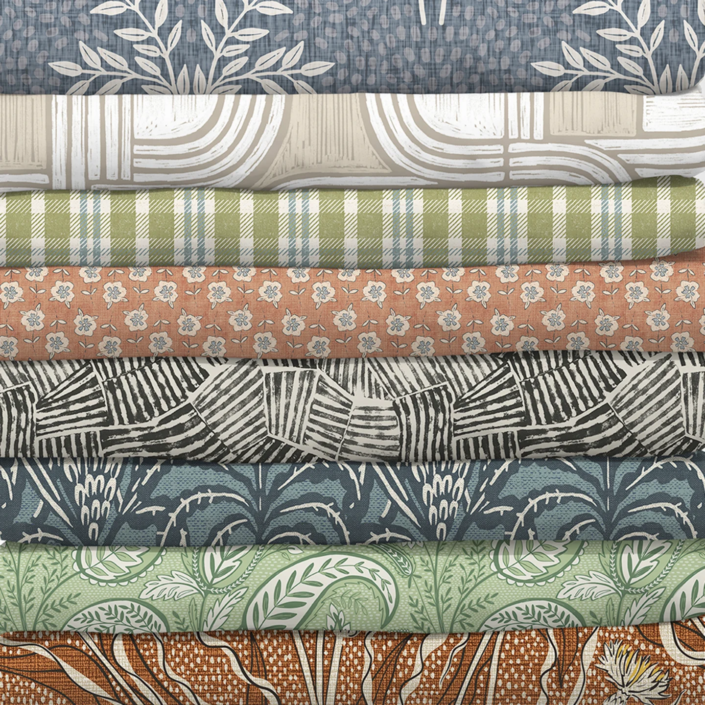 Stack of fabrics from the custom cozy collection.