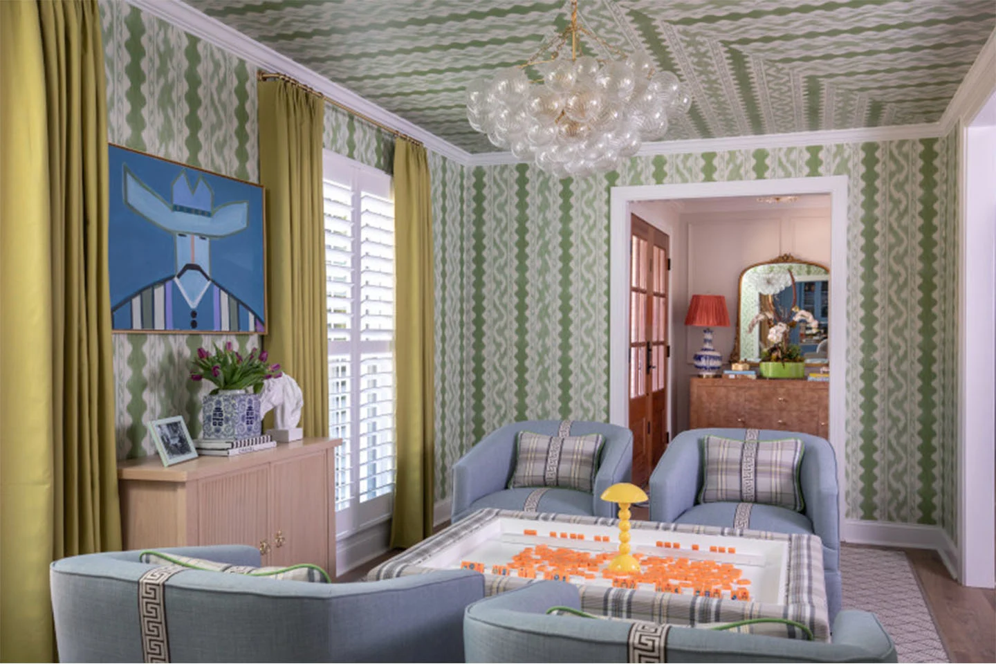 Living room with green striped wallpaper on ceiling and walls.
